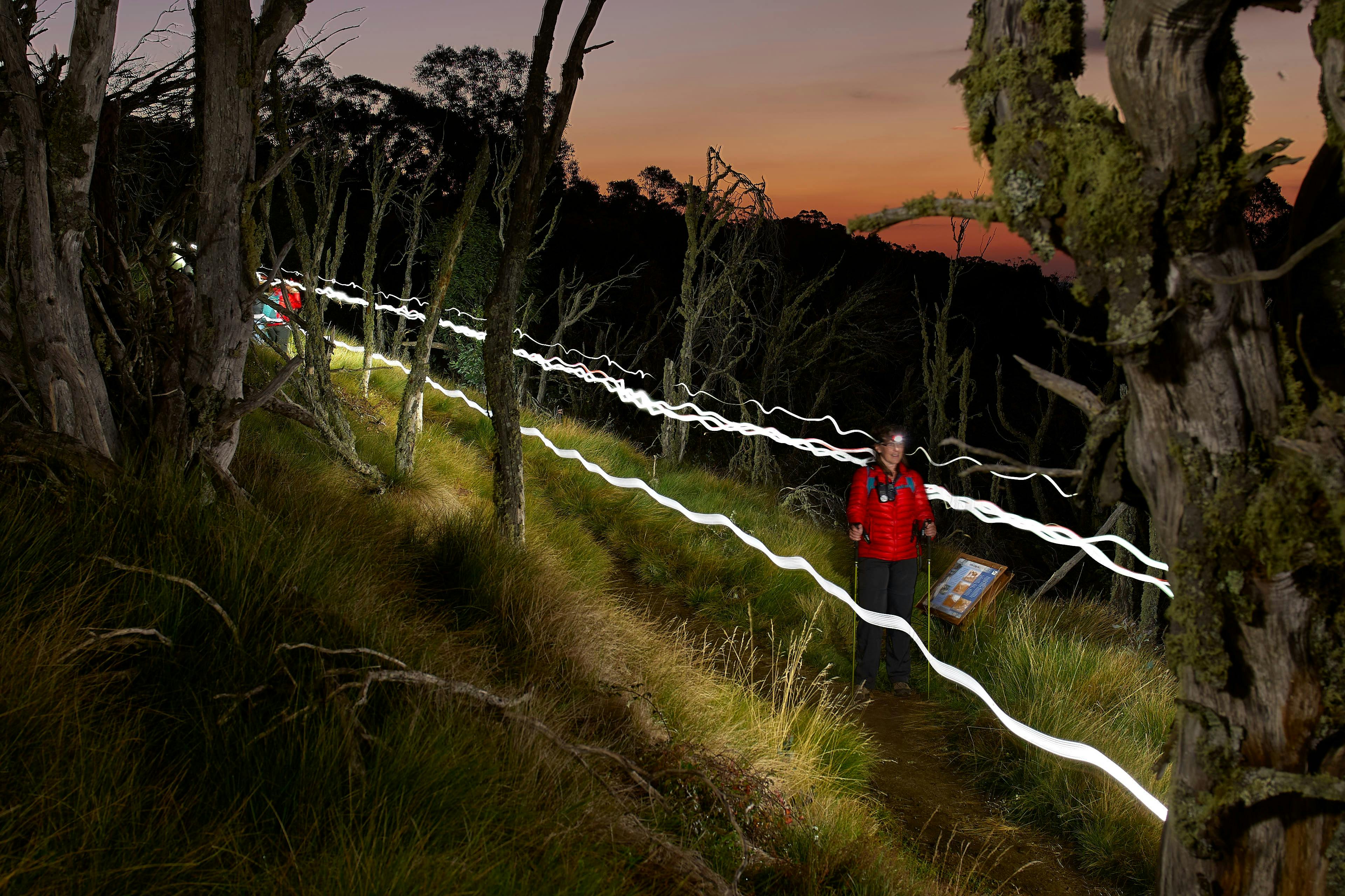 Hiking at night with sunset colours still showing on the horizon.