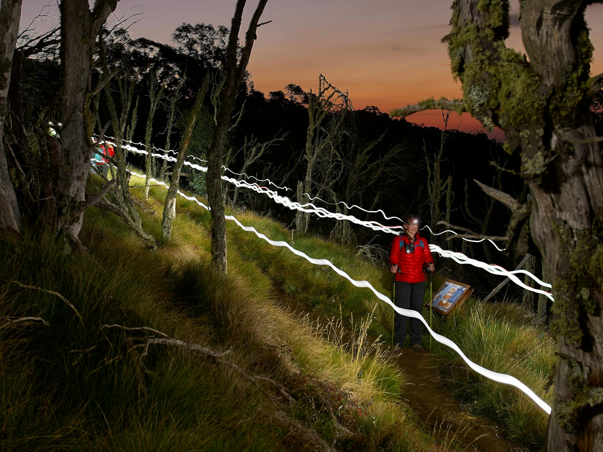 Hiking at night with sunset colours still showing on the horizon.