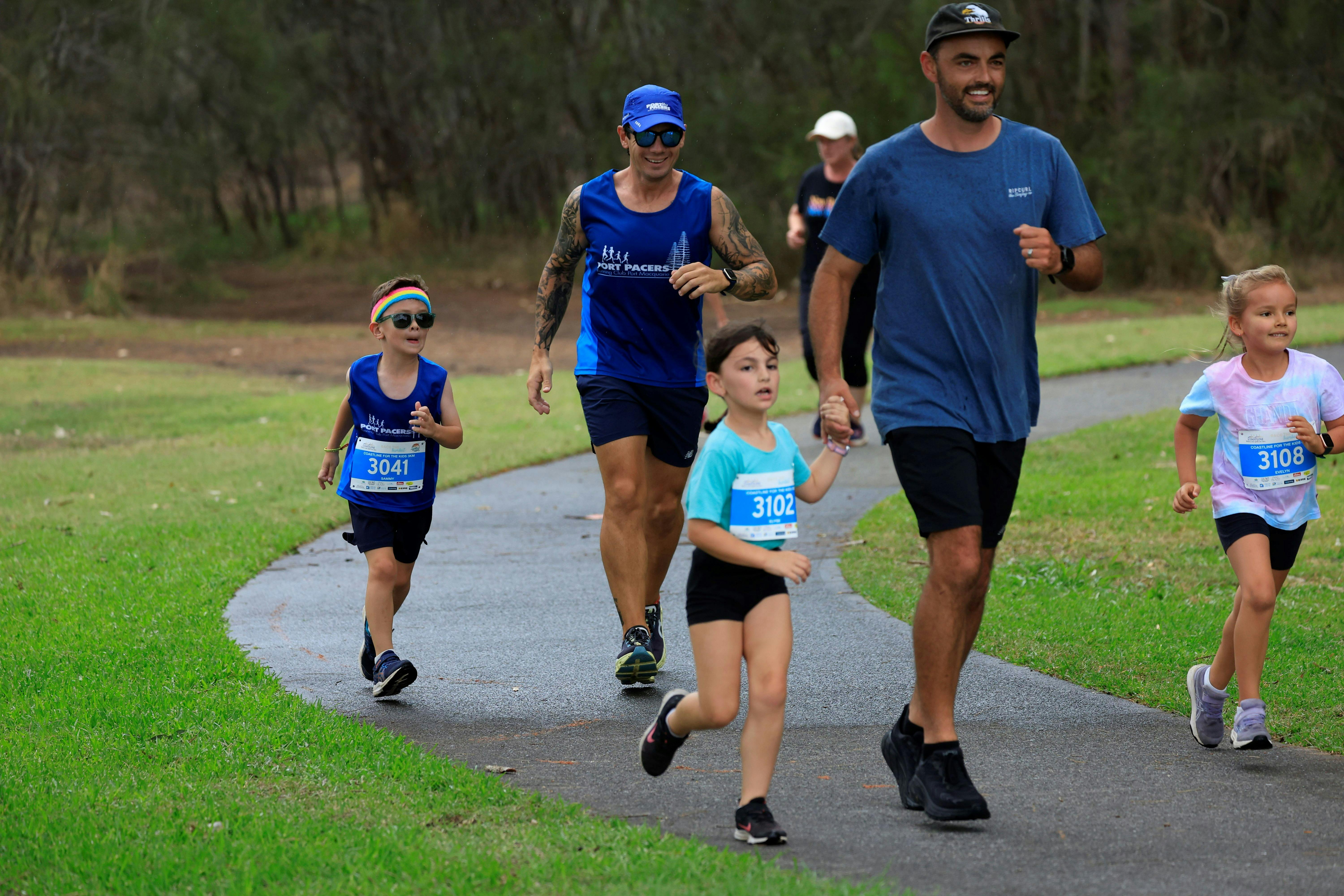 Adults and kids running together