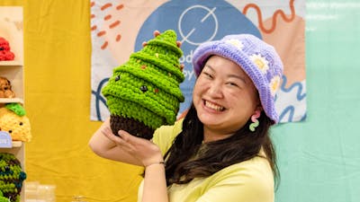 Productive by You holding a crochet Christmas tree