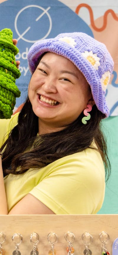 Productive by You holding a crochet Christmas tree