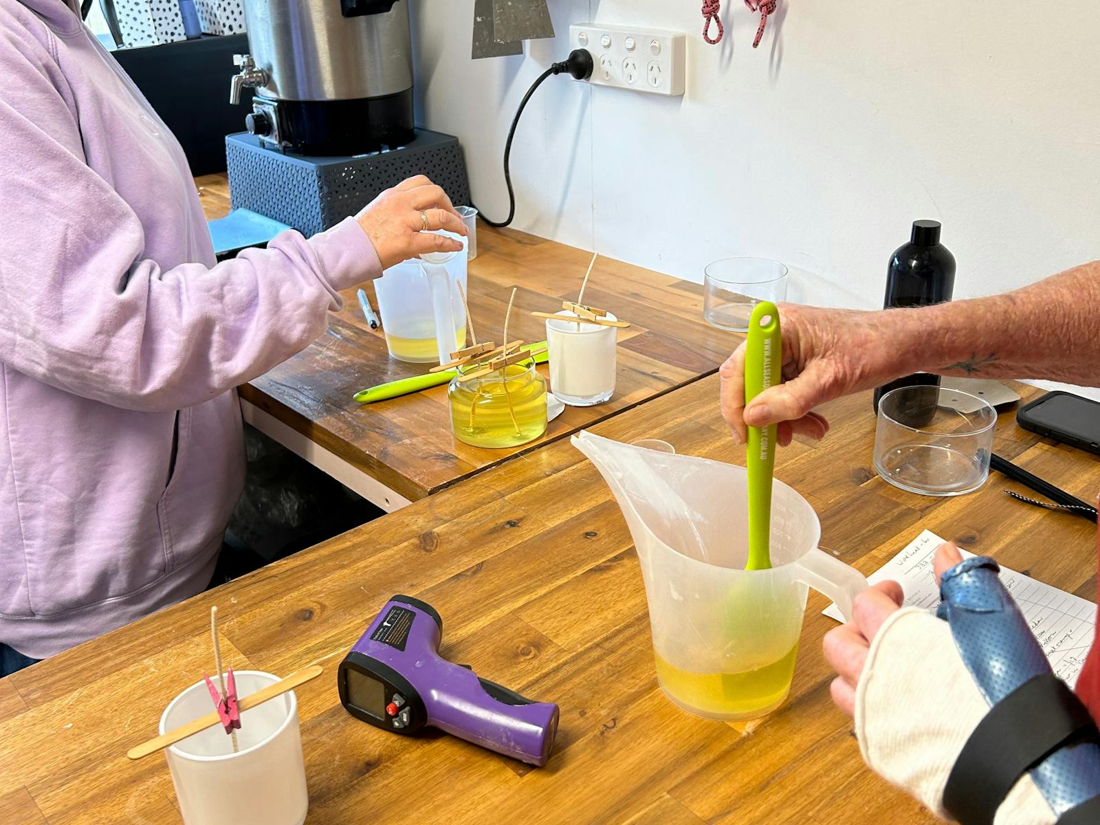 Stirring fragrance into wax