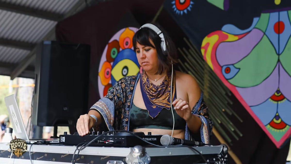 A woman DJ's at Kuranda Roots Festival in Mareeba FNQ.