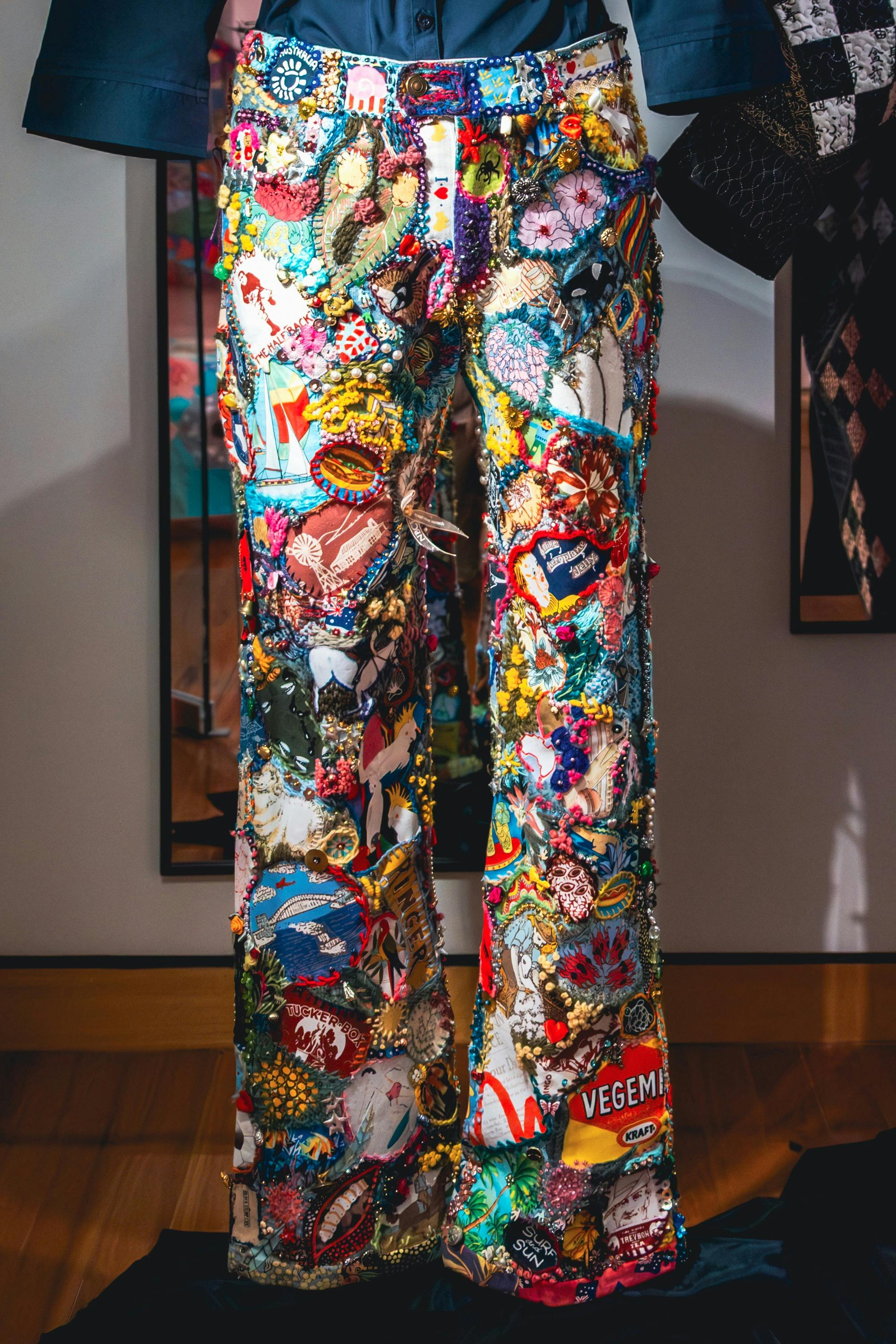 Anyone Seen Those Old Jeans by Wendy Saclier. Detailed shot of jeans, embroidered with bright motifs