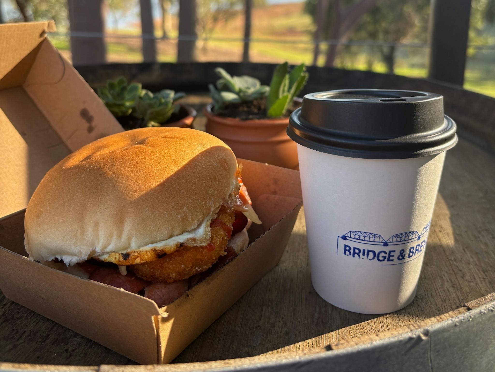 photo of Bacon & Egg Roll with takeaway coffee