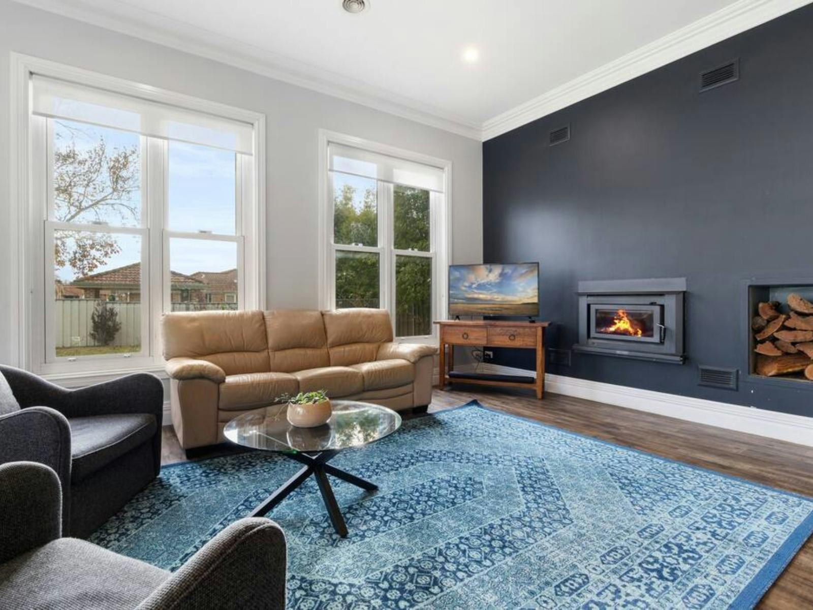 Living room with lots of couches and open area with dining and kitchen