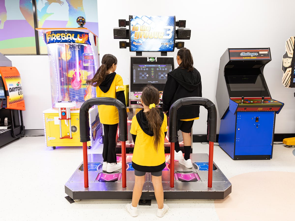 Kids Enjoying Arcade Games
