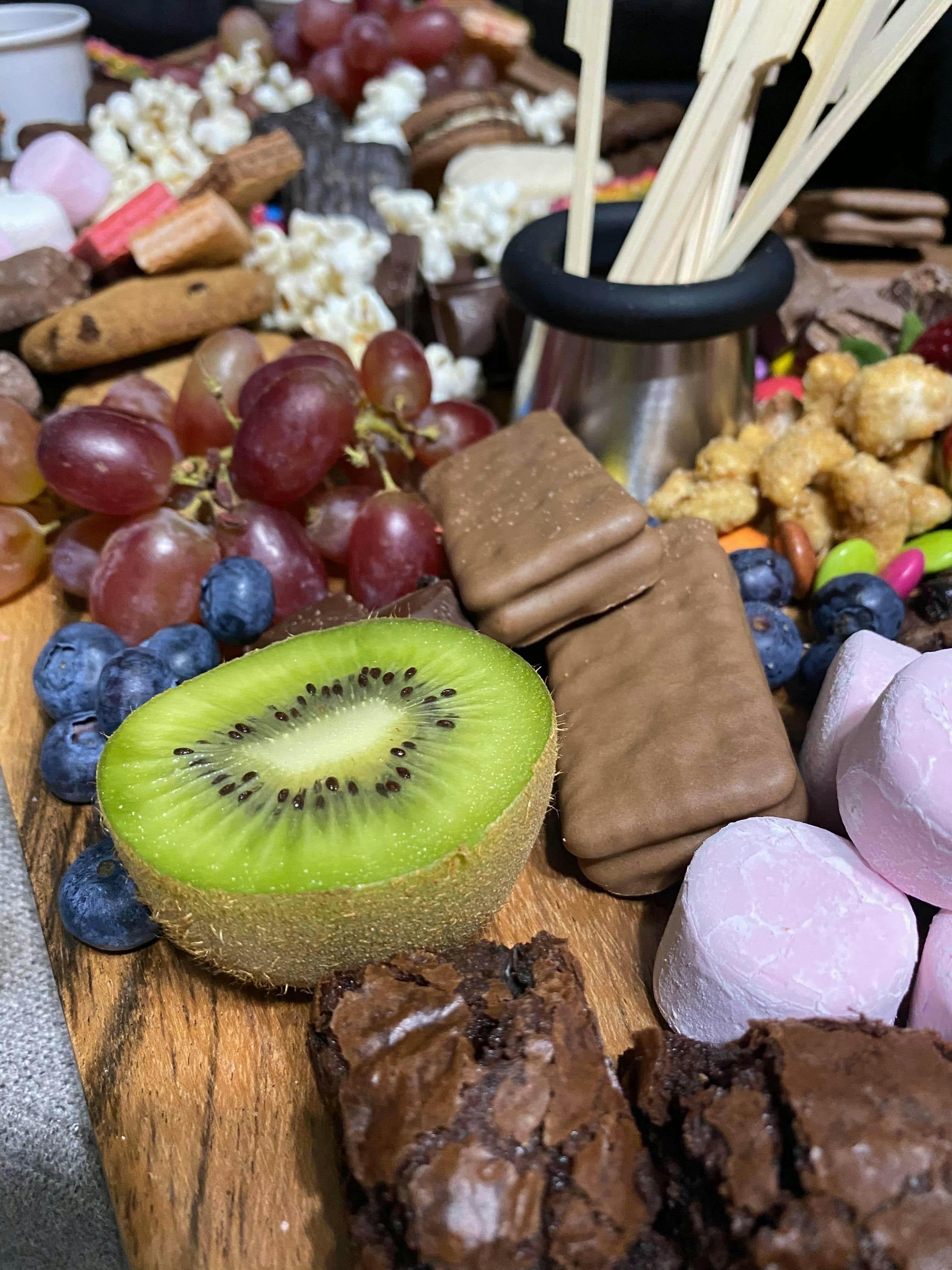 Dessert Platter offered as a sweet option filled with chocolates, fruits dipping sauces and more
