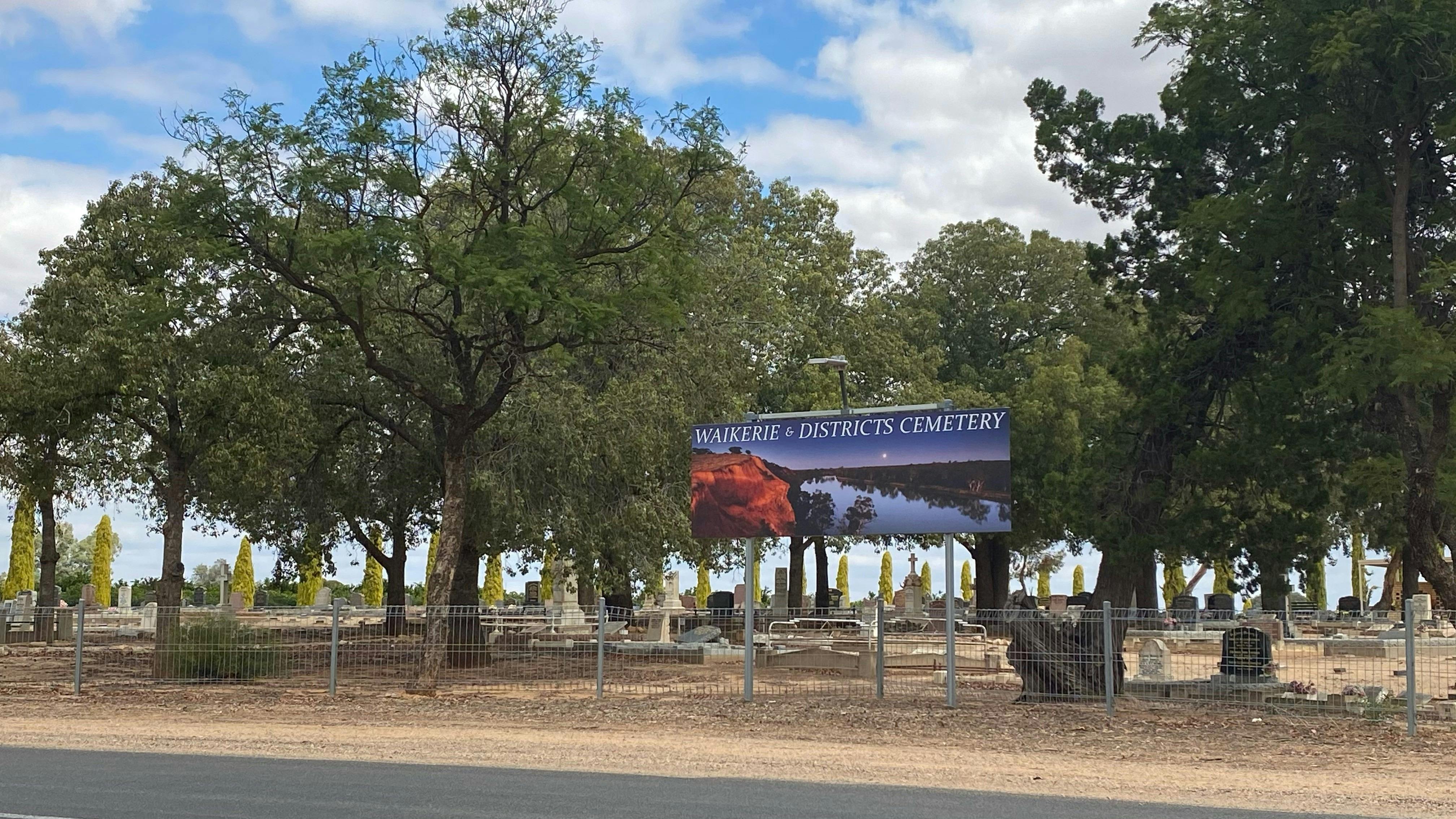 Road view of Waik Cemetery Strangman Rd signage