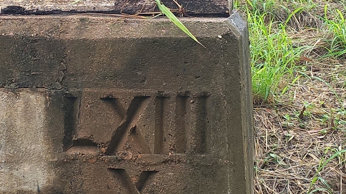 Historic etchings on the concrete bridge pylons.