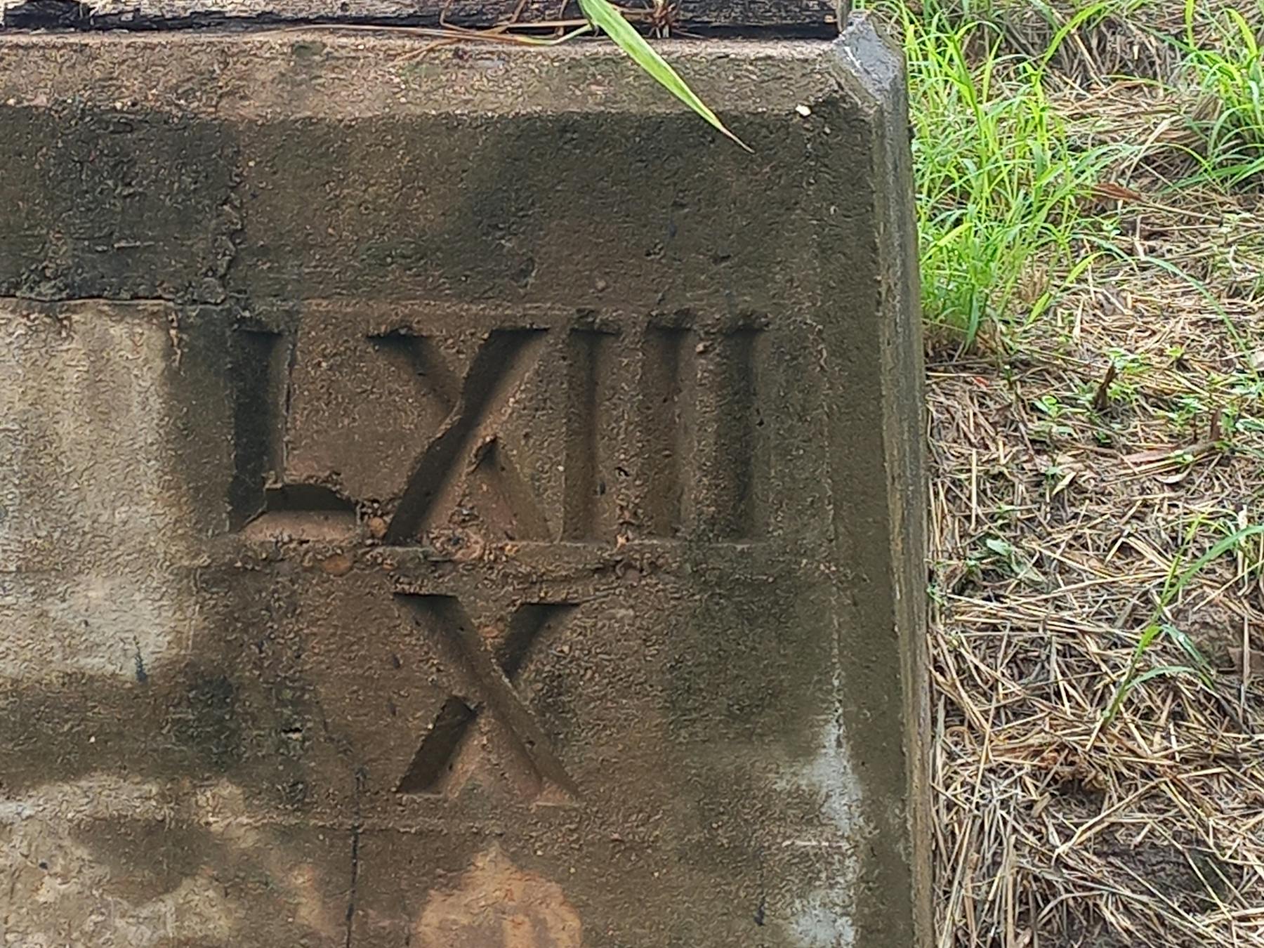 Historic etchings on the concrete bridge pylons.