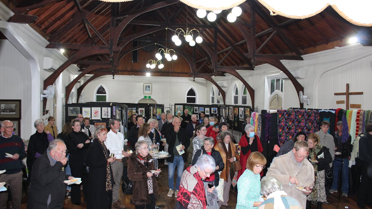 Crowds gather to view and buy art and to mingle and chat