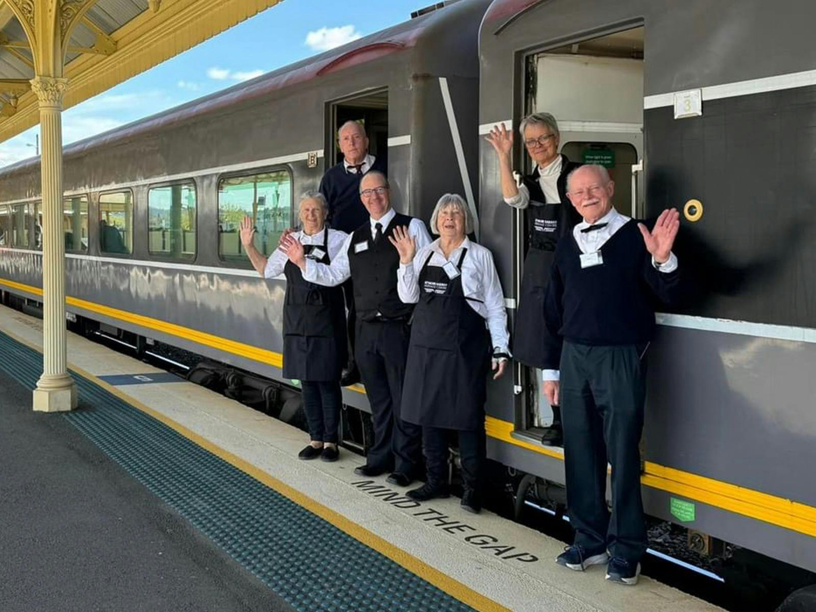 Staff welcome passengers aboard