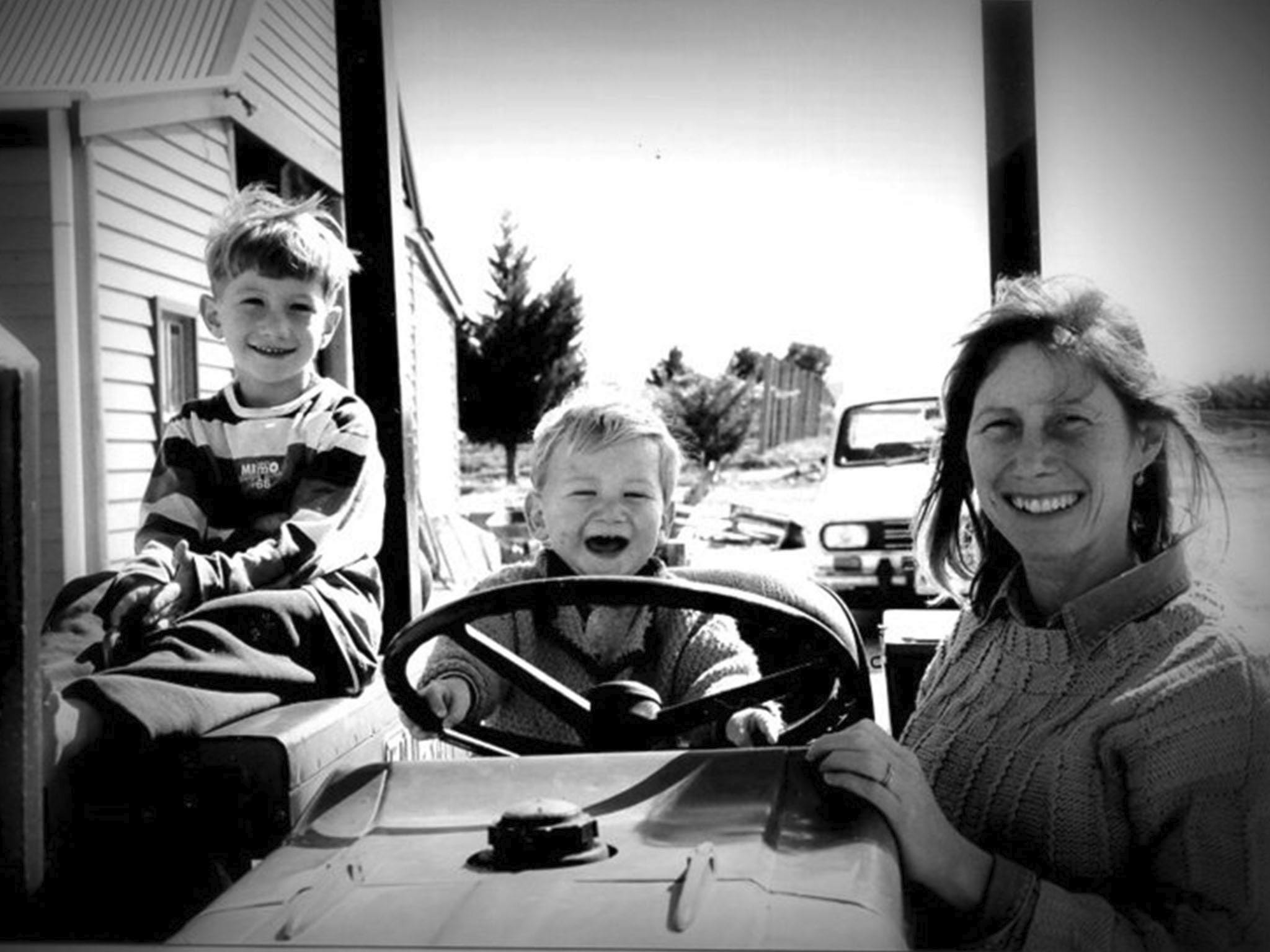 Mother with young sons in an old tractor