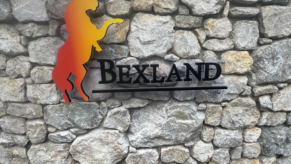 Bexland sign on Stone wall