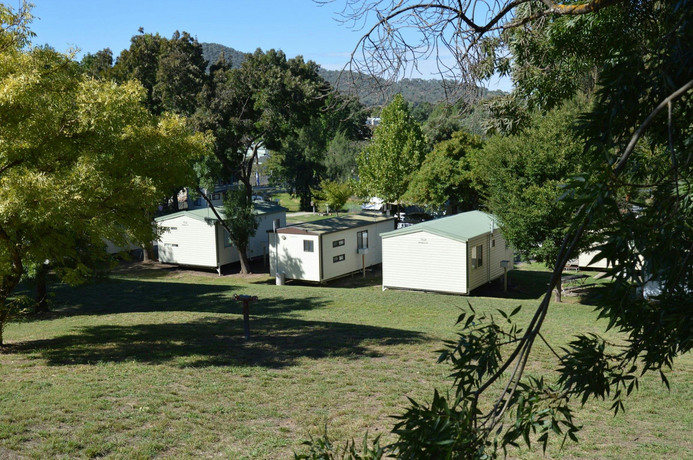 Adelong Golden Gully Caravan Park cabins from up the hill, looking towards the town of Adelong