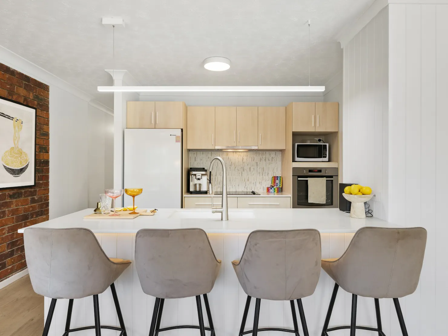 Open-plan kitchen with breakfast bar and Coffee machine