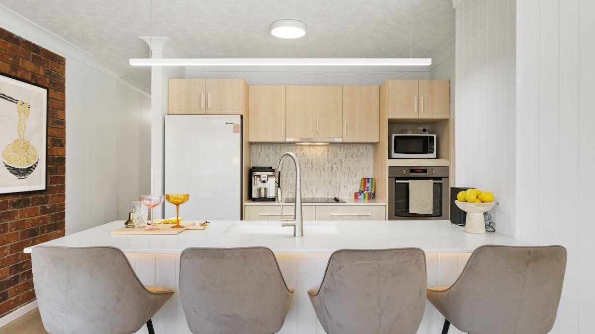 Open-plan kitchen with breakfast bar and Coffee machine
