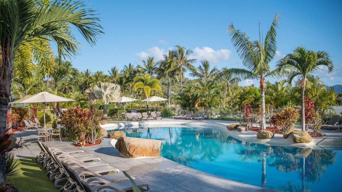 Lush tropical gardens surround the Whitsunday Apartments Hamilton Island Pool