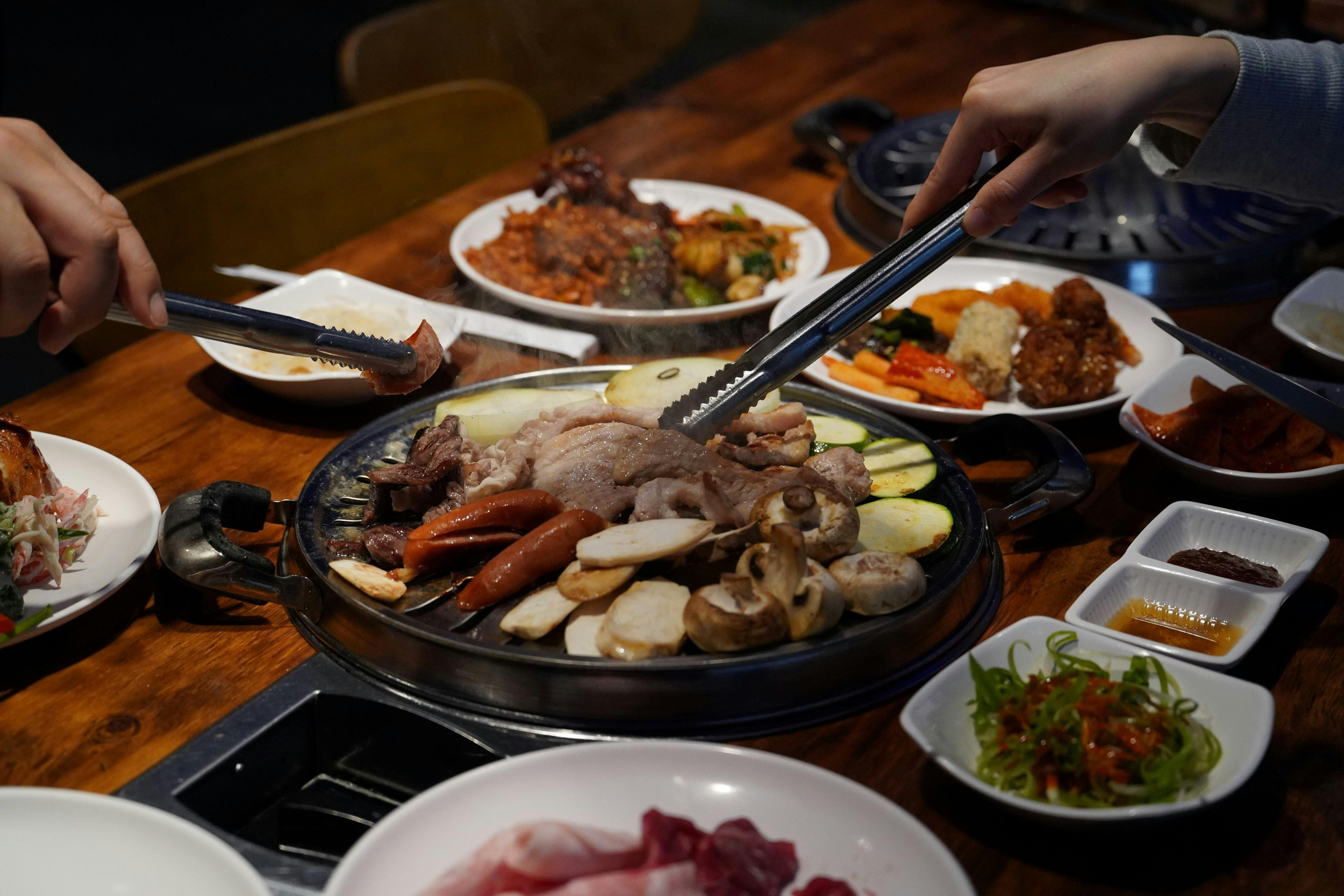 Korean BBQ meat cooking on the grill at Butchers Buffet
