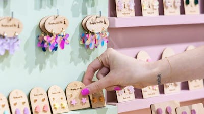 Customer picking Murphy and Me earrings