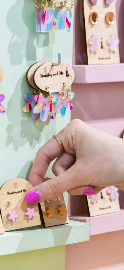 Customer picking Murphy and Me earrings