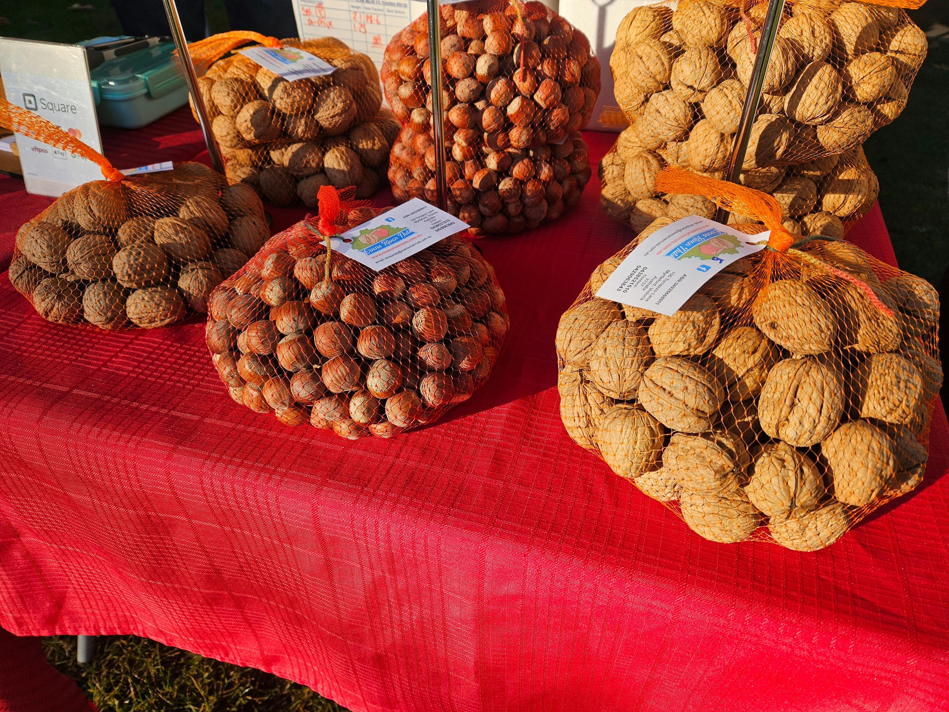 Nuts in shells placed on a red table