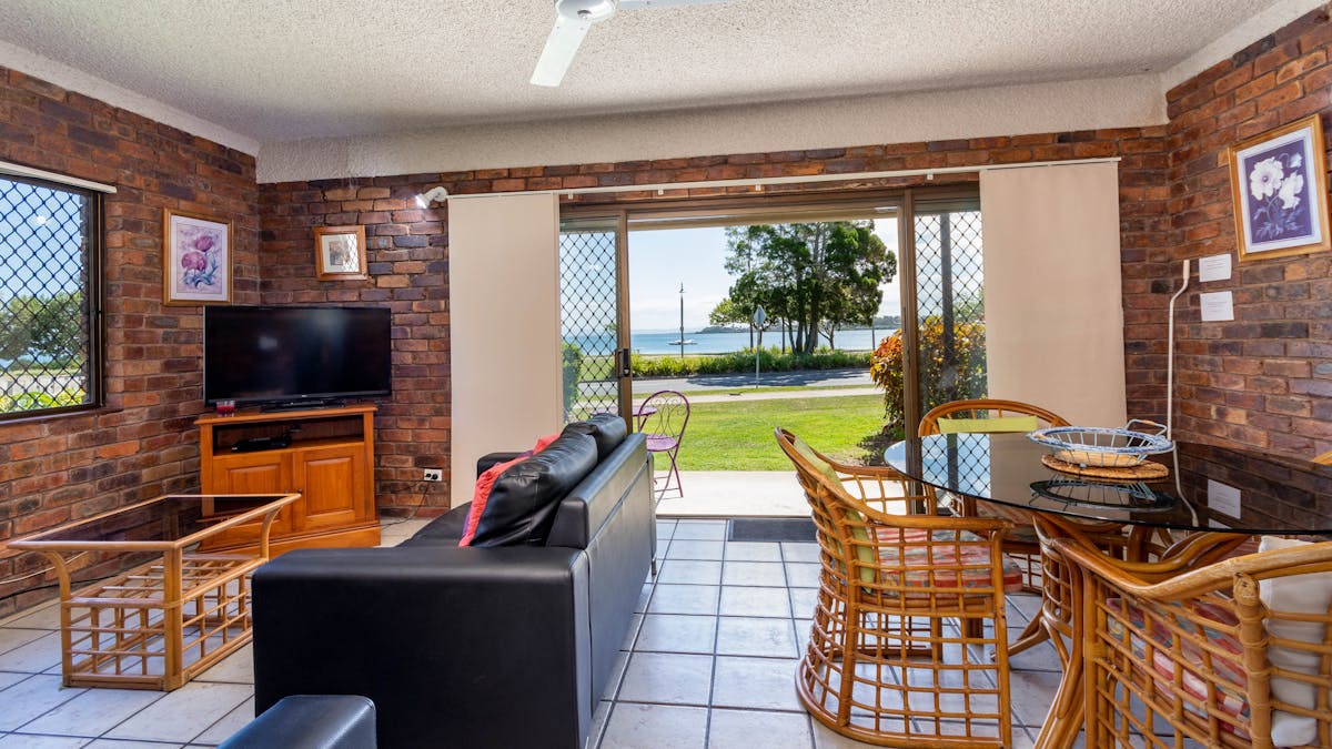 Lounge and dining area with water views