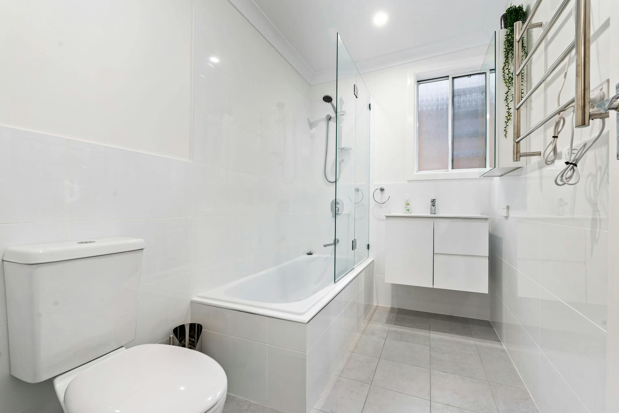 Bathroom with toilet, bath, shower and vanity