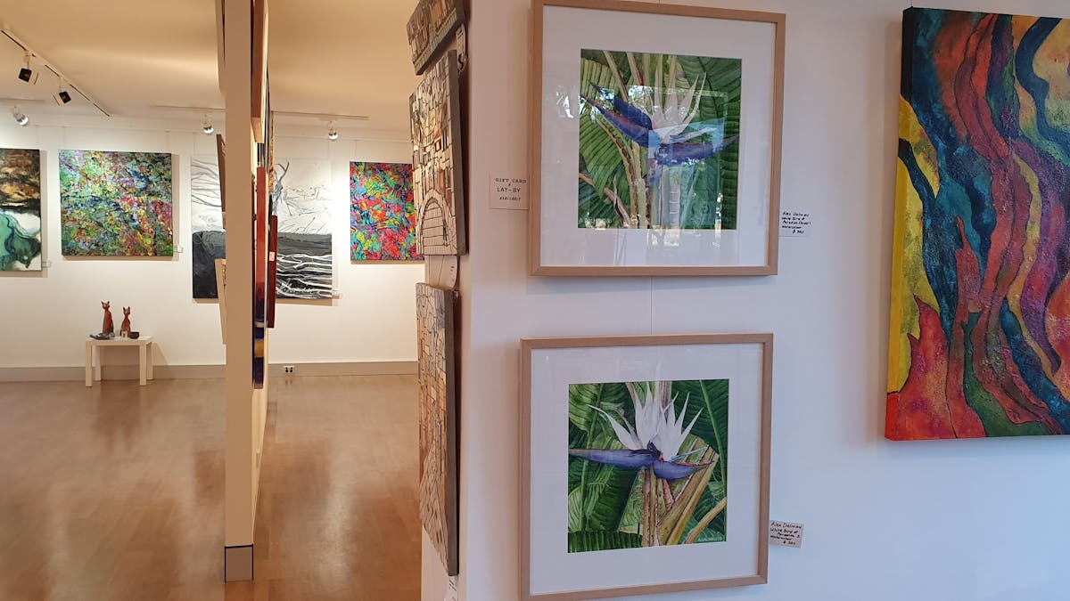 colourful artworks hanging in a gallery colourful artworks hanging in a gallery