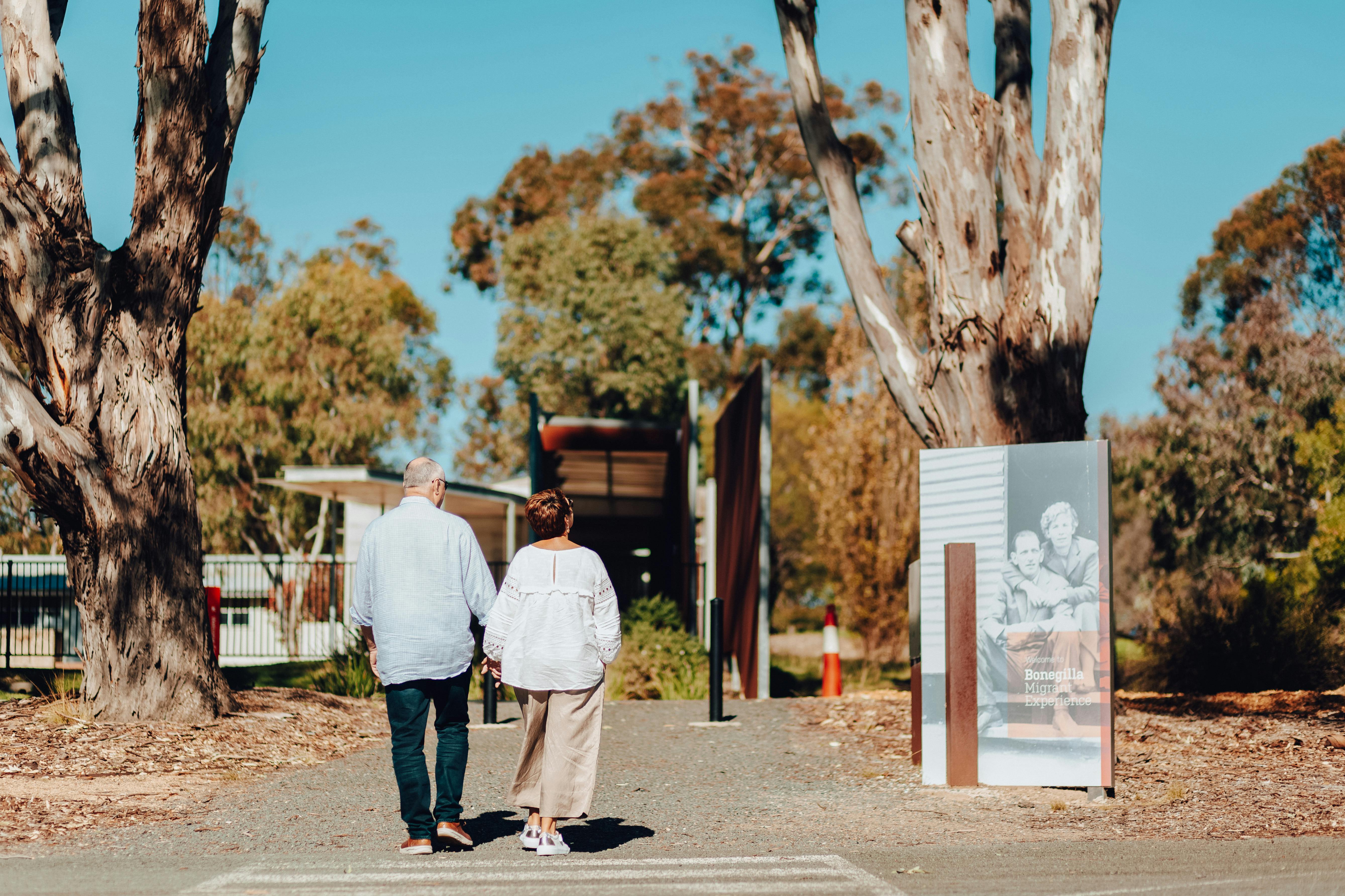 two people walking at the Bonegilla Migrant Experience