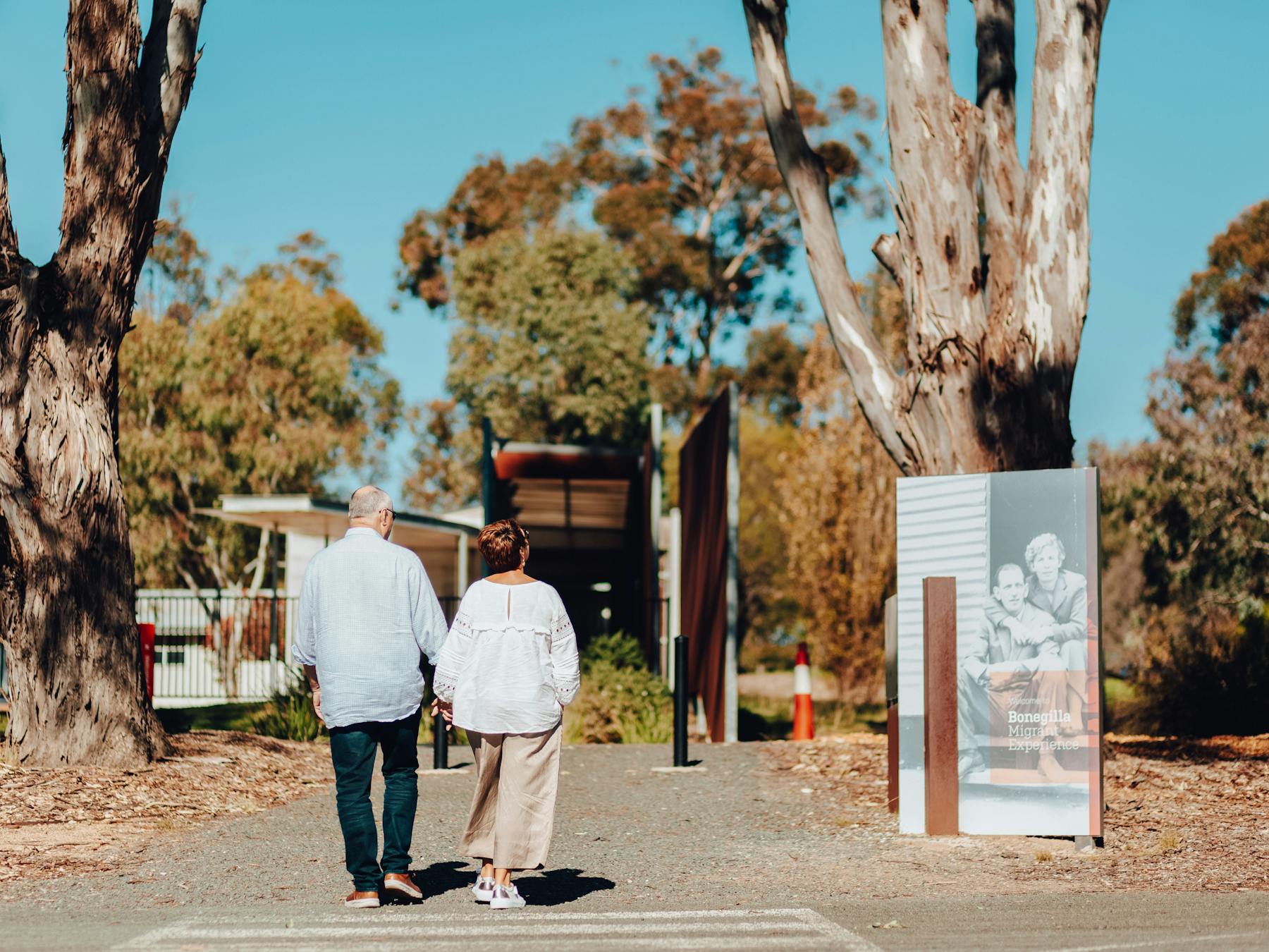 two people walking at the Bonegilla Migrant Experience