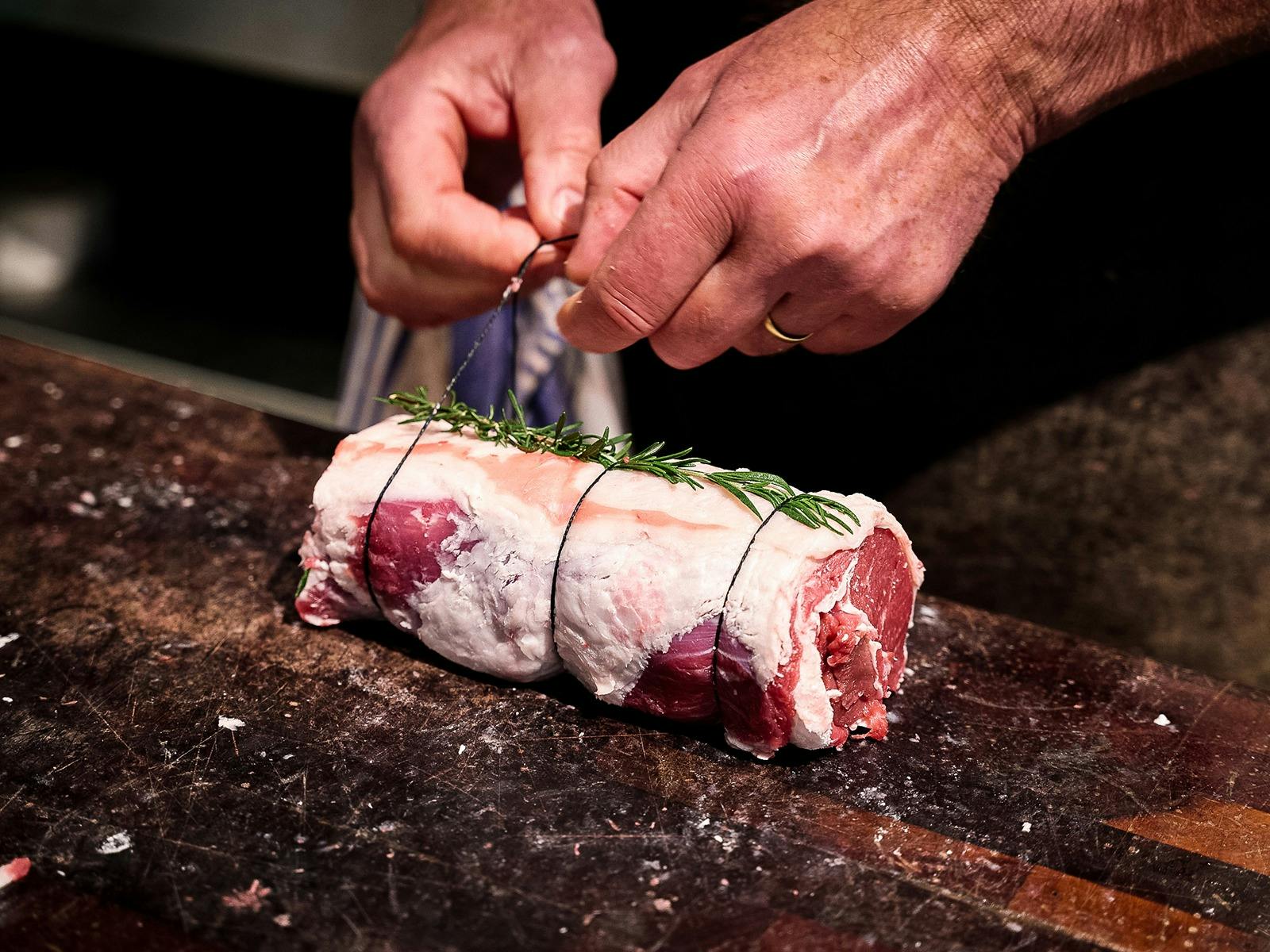 Tying steak with butcher twine