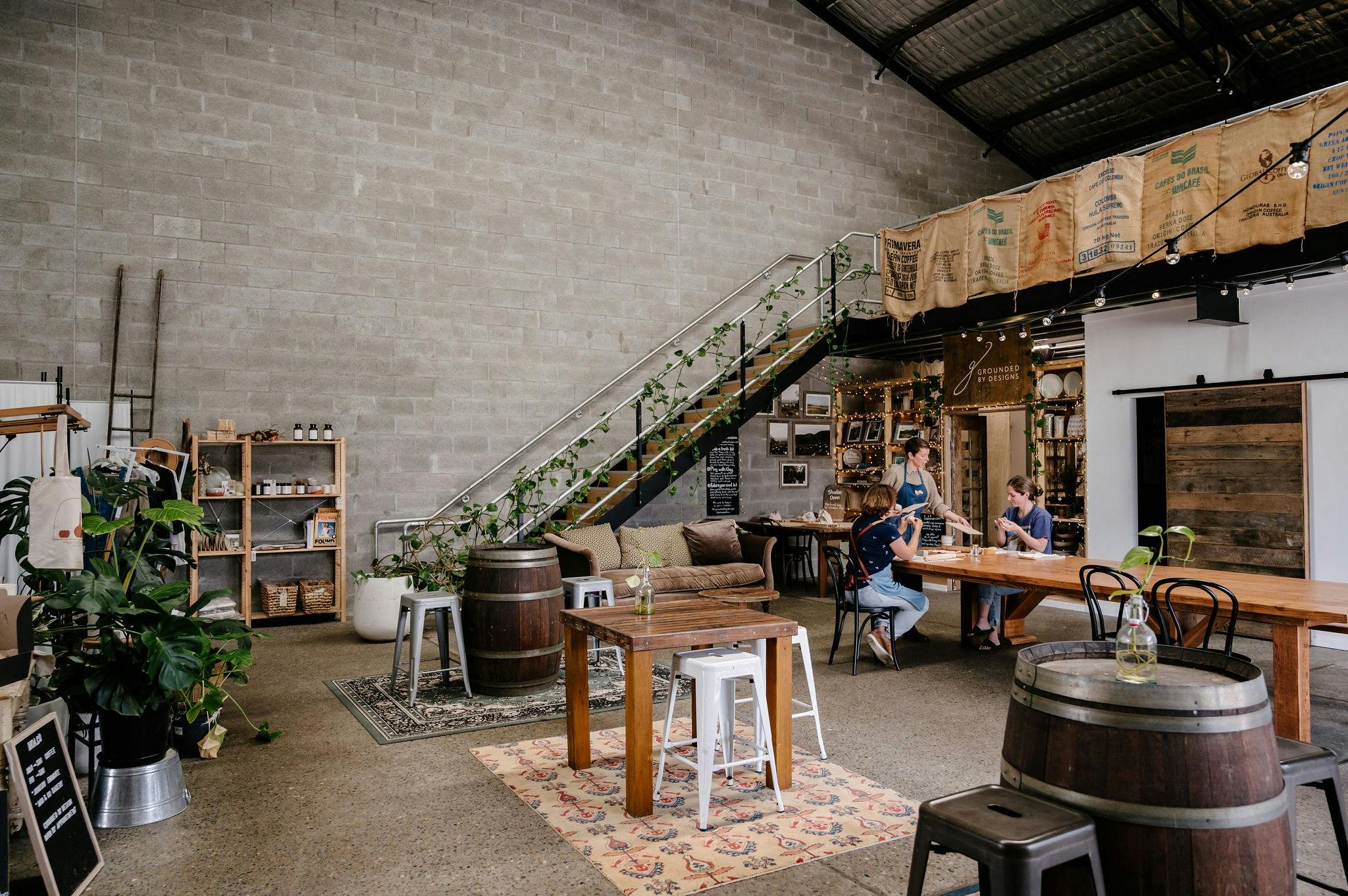MOA & Co’s cosy warehouse in Carrington with rustic furniture, greenery, and ceramic workshop in act