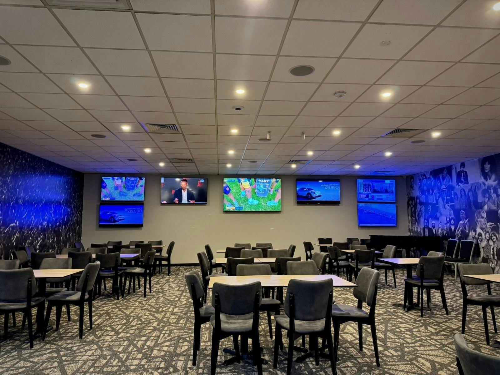 Dine in the Rock Lounge, with multiple screens throughout the space.
