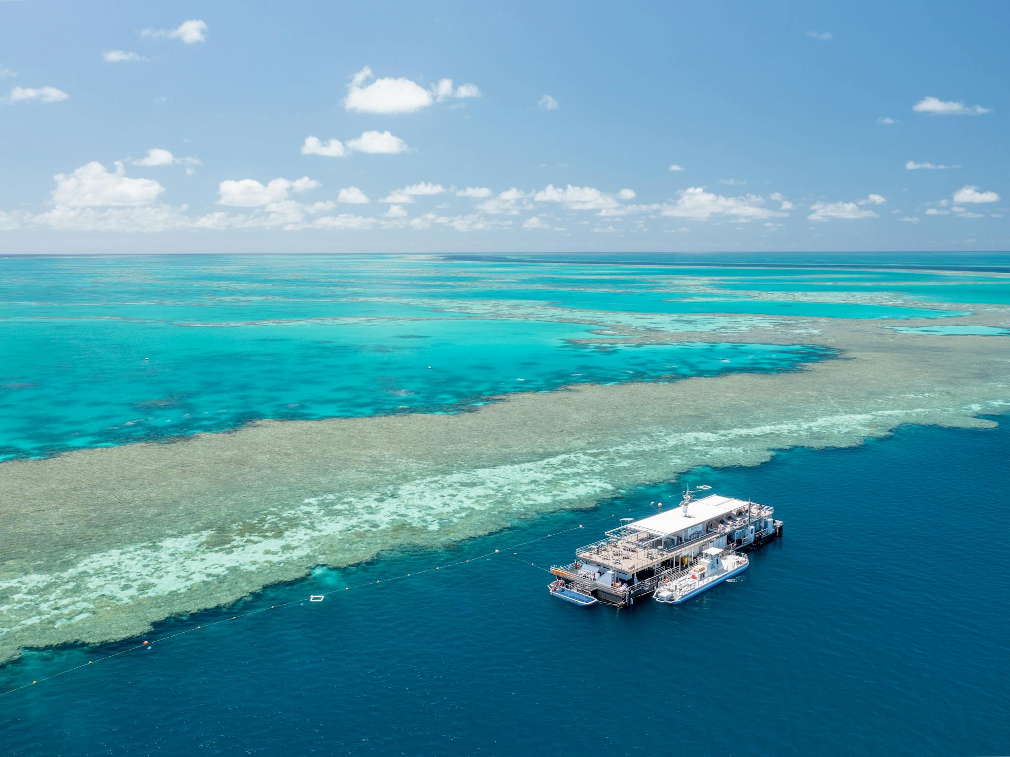 A big pontoon moored along the Great Barrier Reef wall