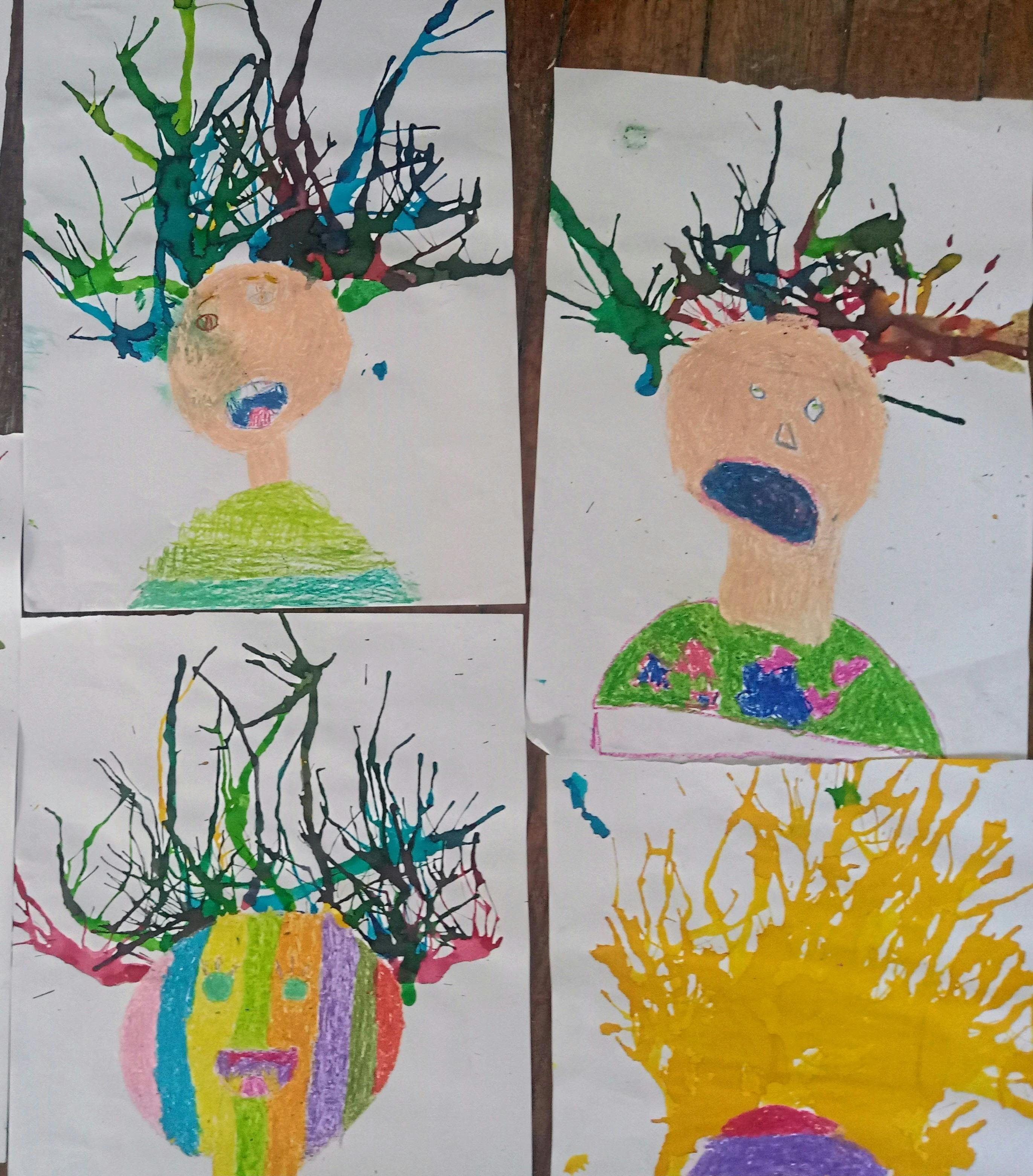 Portraits using crayon and paint blown with a straw