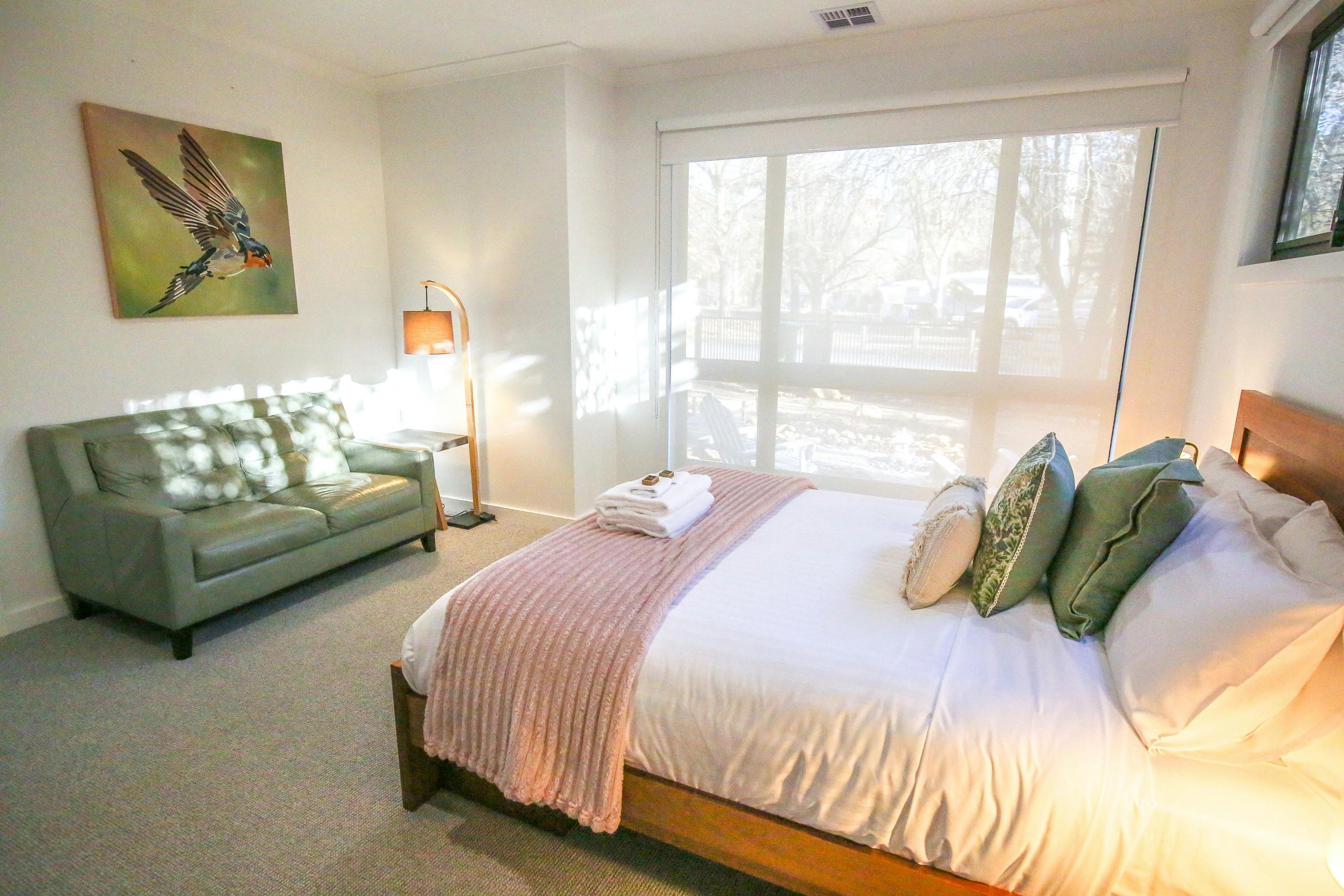 Bedroom with queen bed and sitting area