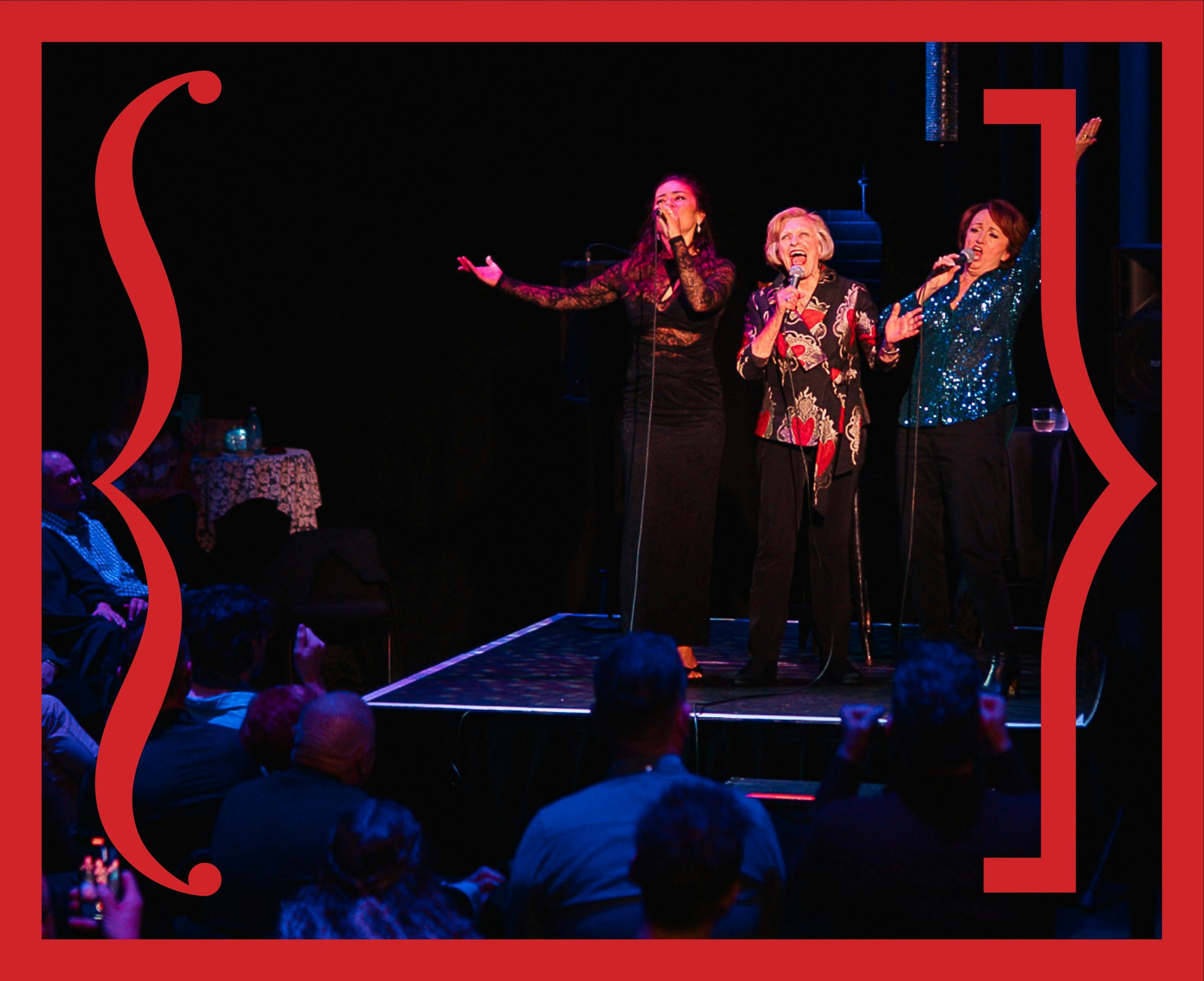 Three performers on stage