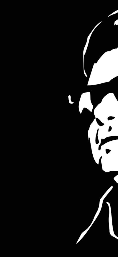 A black and white image of a man with sunglasses on in front of a black background