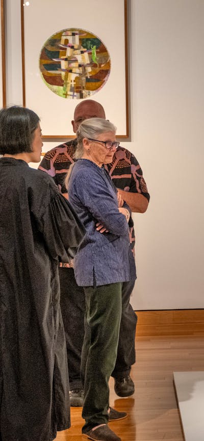 People observing Hiroe Swen's ceramics at Canberra Museum + Gallery