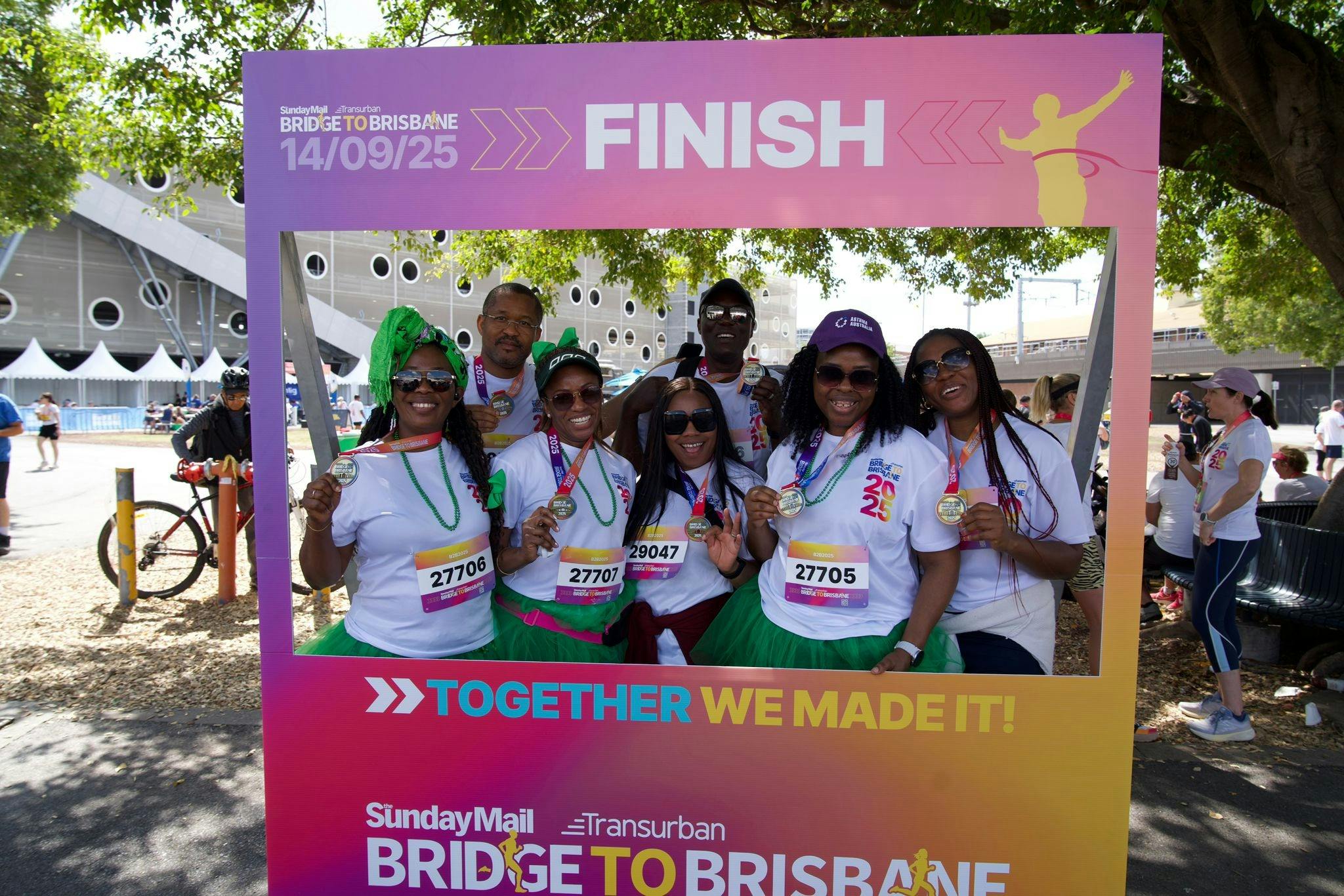 People having their photo taken inside an instagram frame that says Finish.