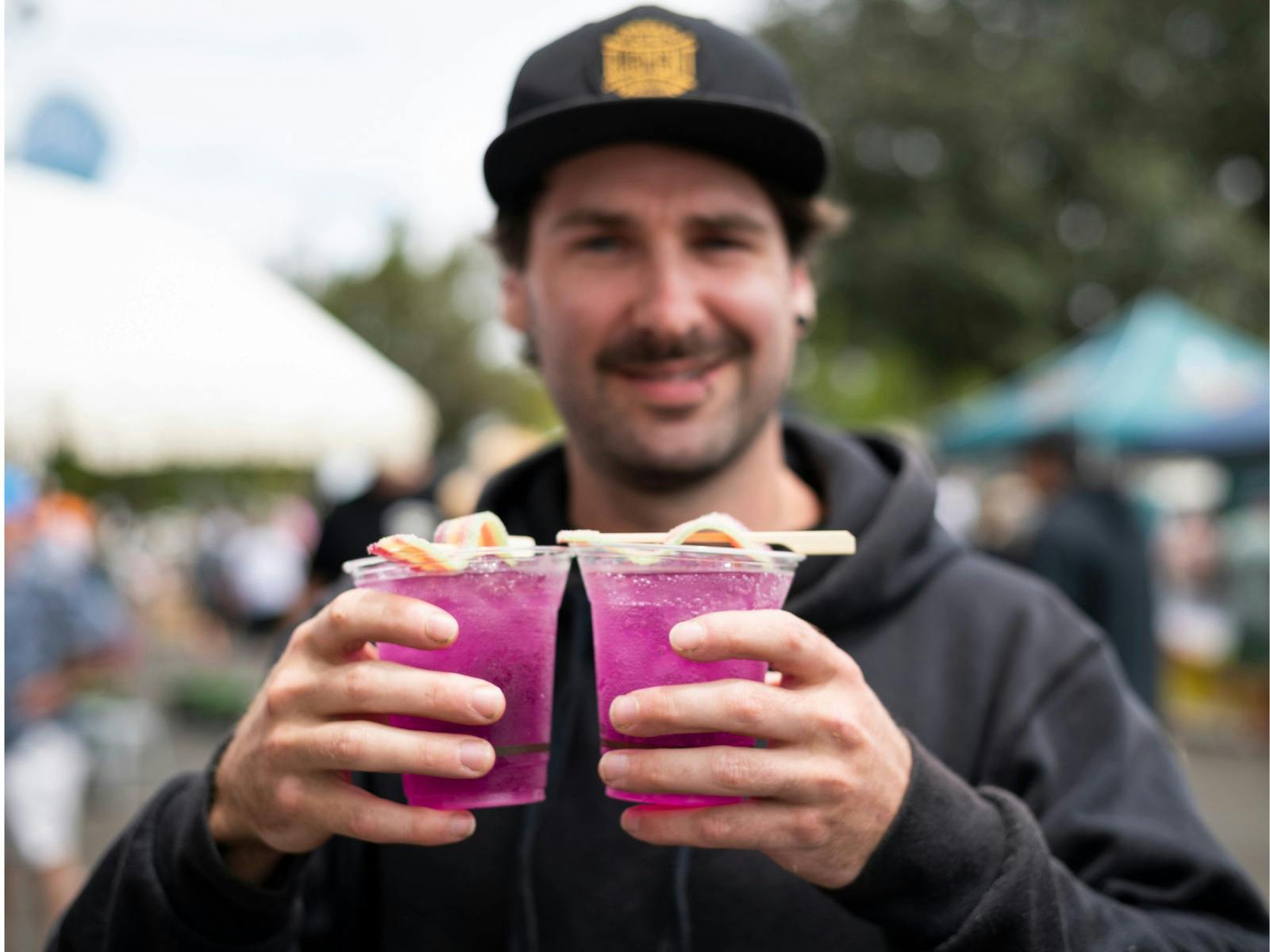 Festival guest with drinks at the Spirits of Jervis Bay Festival