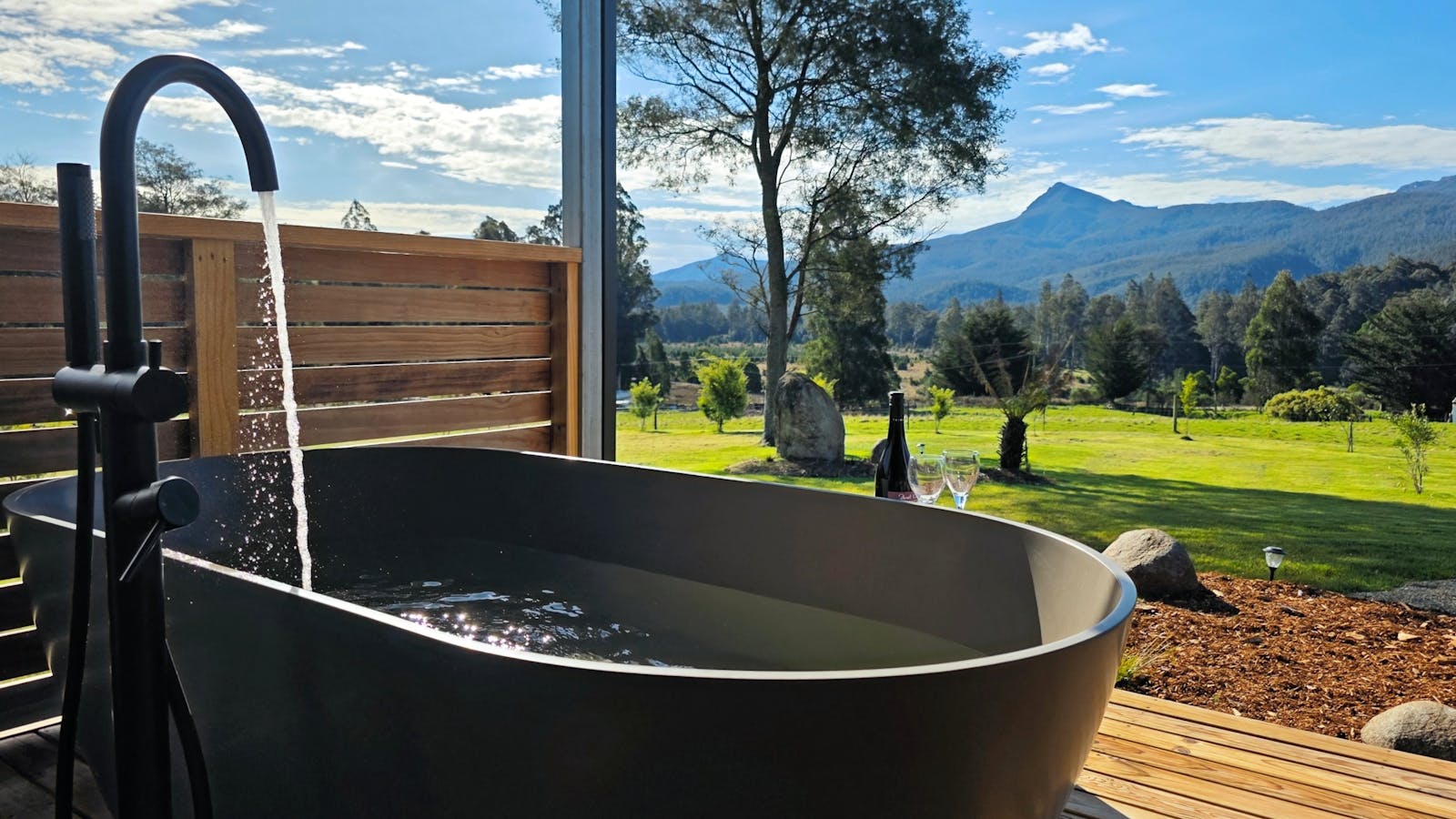 Soak in the outdoor bath with views over the grounds to the forest and mountain peaks of Mt Field.