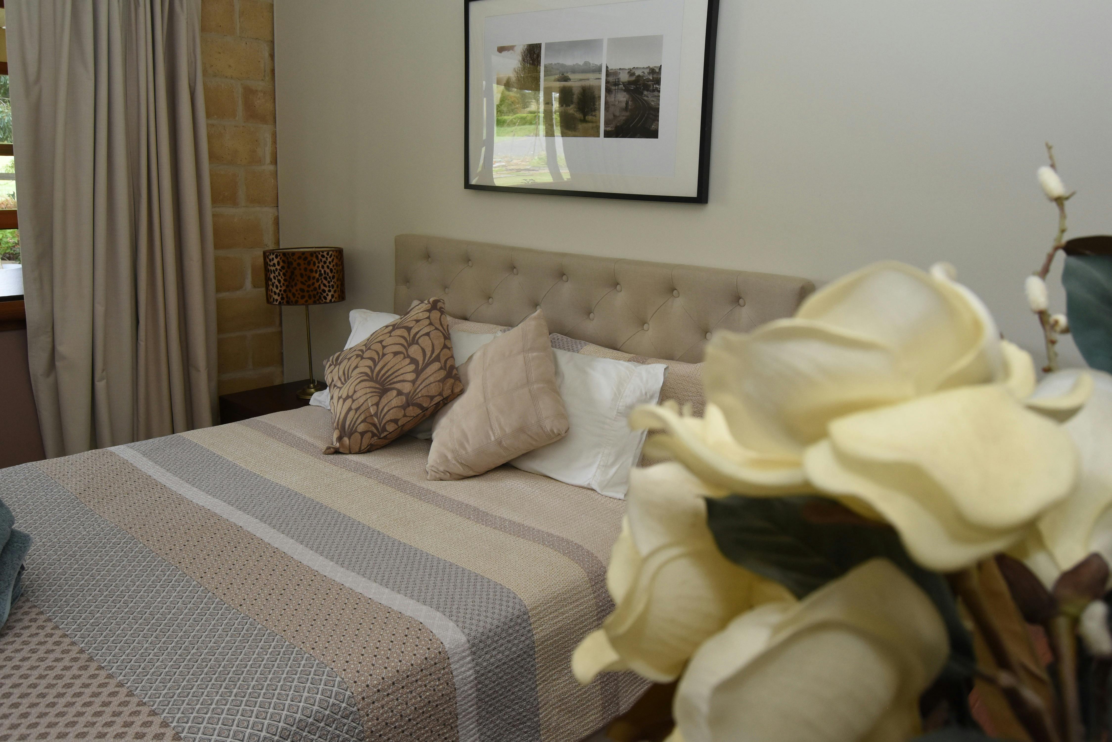 Bedroom number one features a queen sized bed