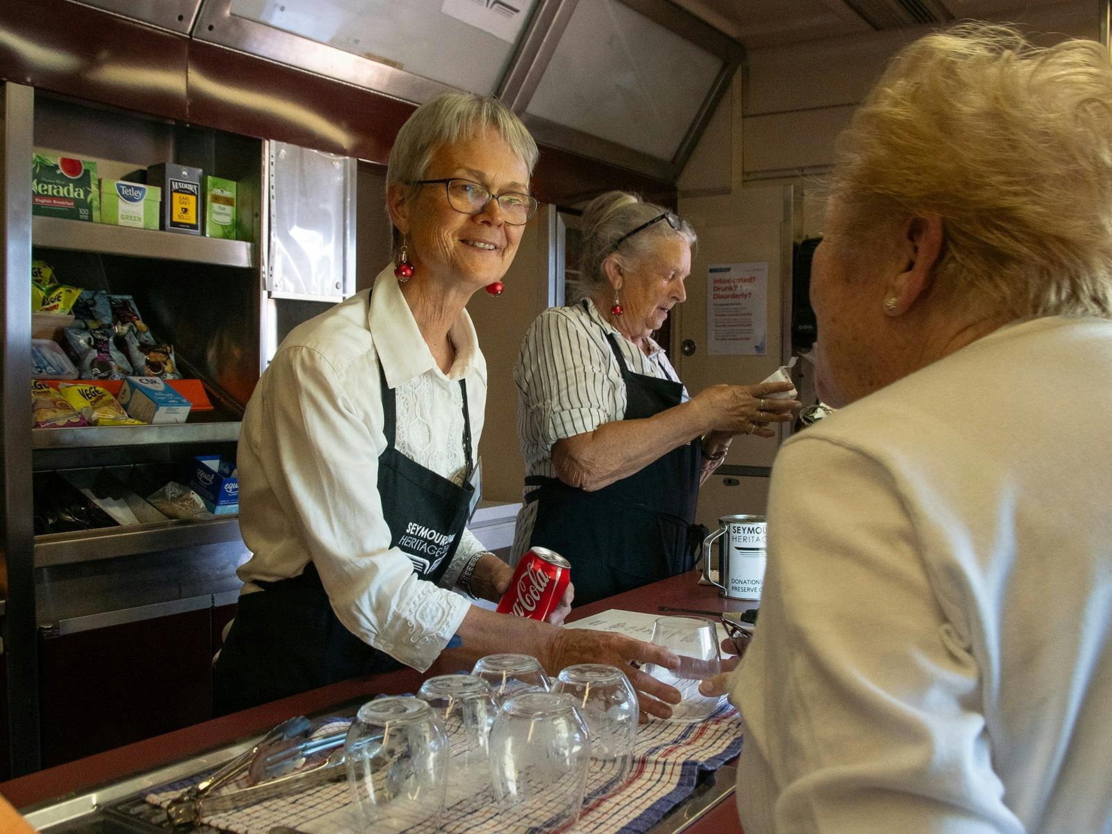 Onboard staff serving refreshments