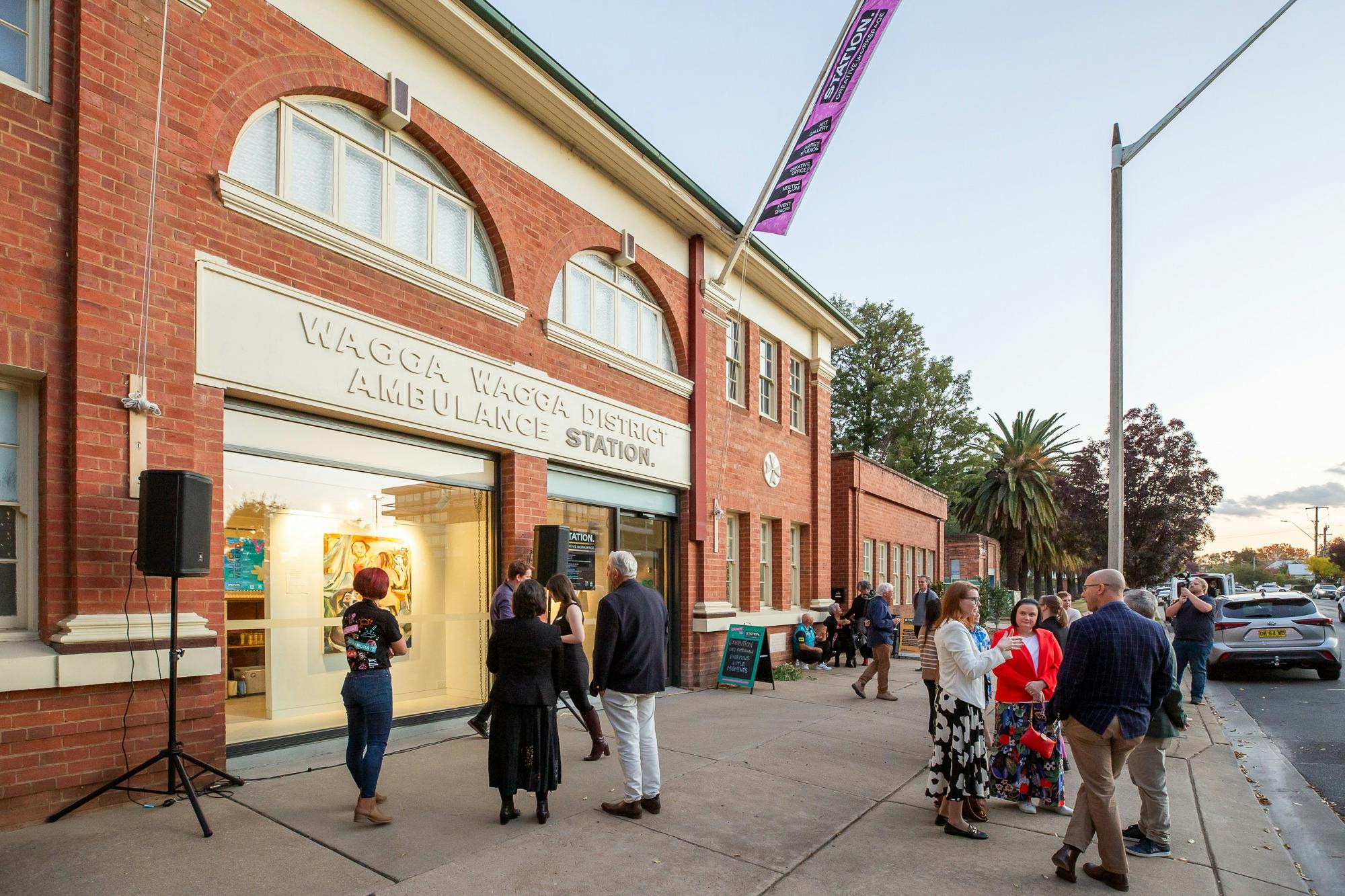 Red brick ambulance station building facade, now operating as an art gallery.