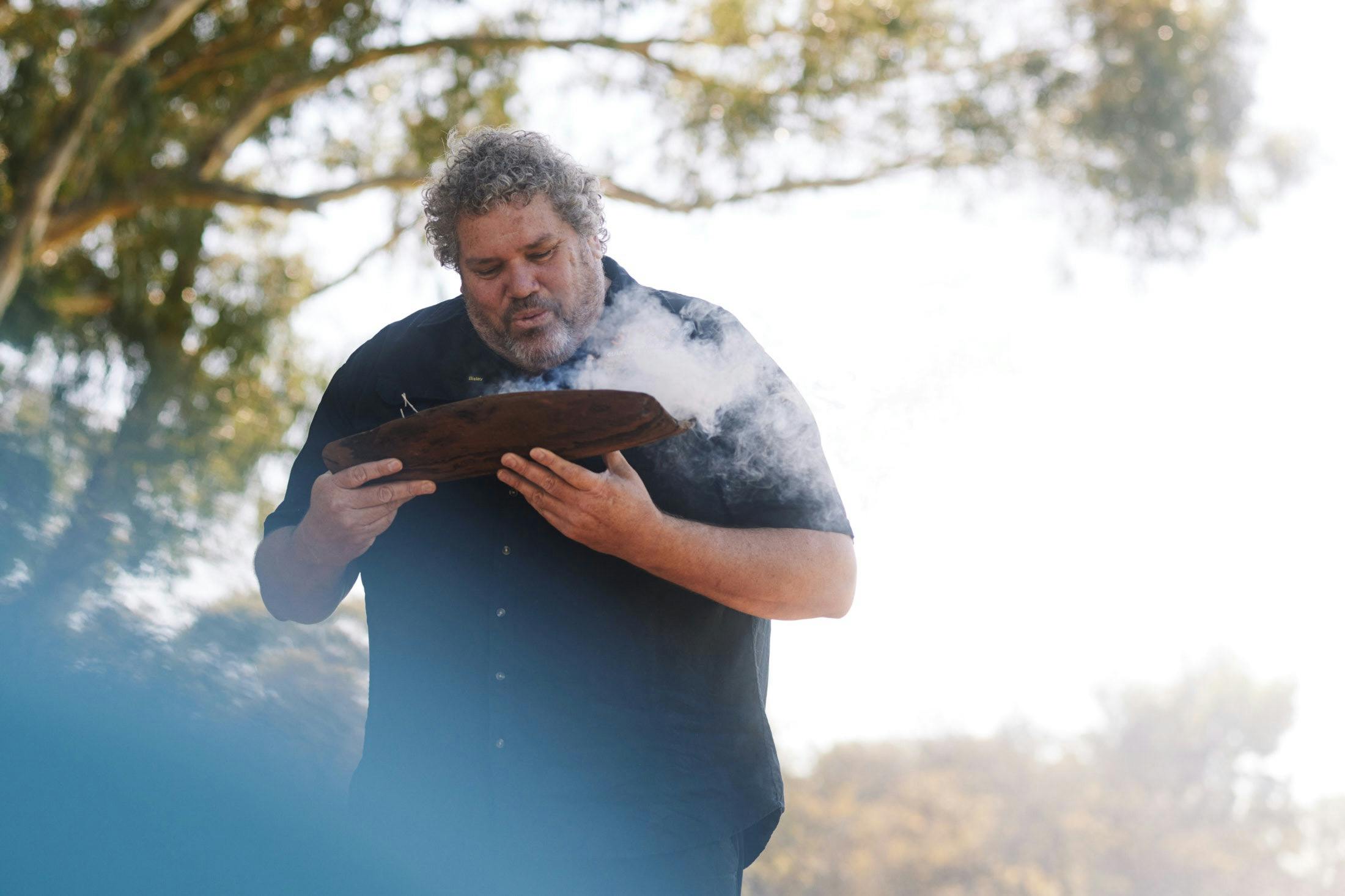 Guide conducting smoking ceremony