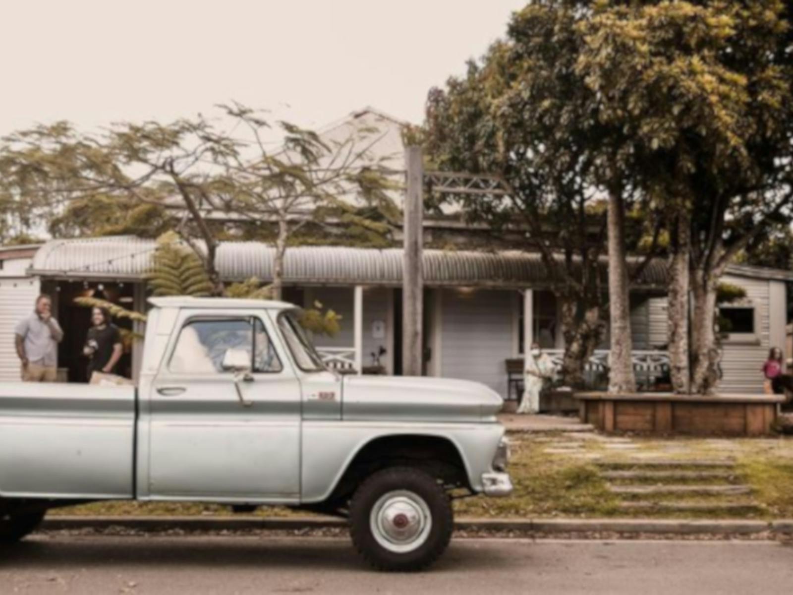 Picture of the shop front with old ute in foreground