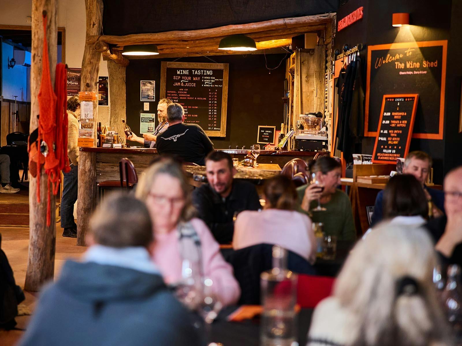 Inside the Black & Ginger Wine Shed, guests enjoying an event